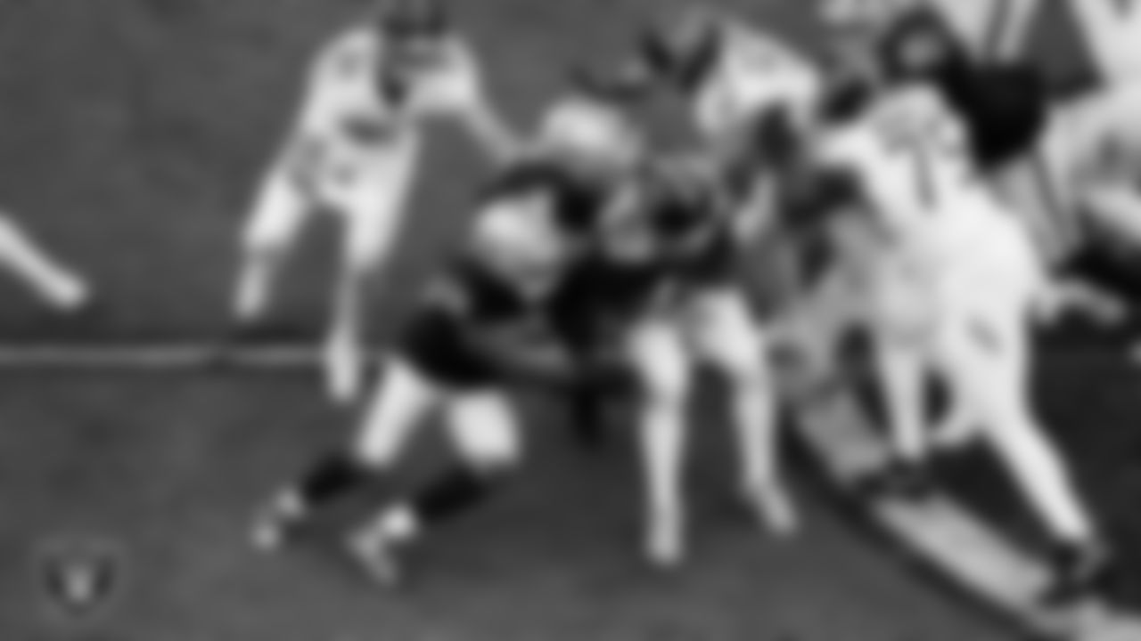 Las Vegas Raiders defensive end Tyree Wilson (9) makes a tackle during the regular season home game against the Tennessee Titans at Allegiant Stadium.