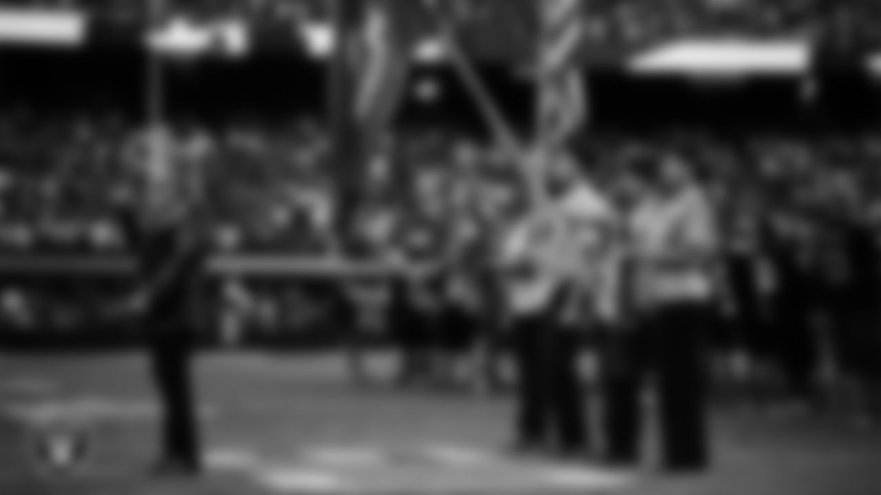 Singer Bucky Heard performs the national anthem while The Navy Junior ROTC from Chaparral High School presents the nation's colors before the Las Vegas Raiders' preseason home game against the San Francisco 49ers at Allegiant Stadium.