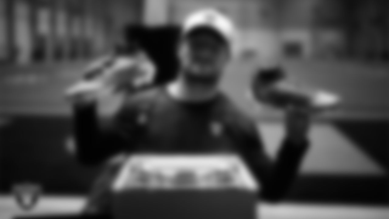 Las Vegas Raiders running back Dylan Laube (23) unboxes his custom cleats for the NFL's My Cause My Cleats initiative at Intermountain Health Performance Center.