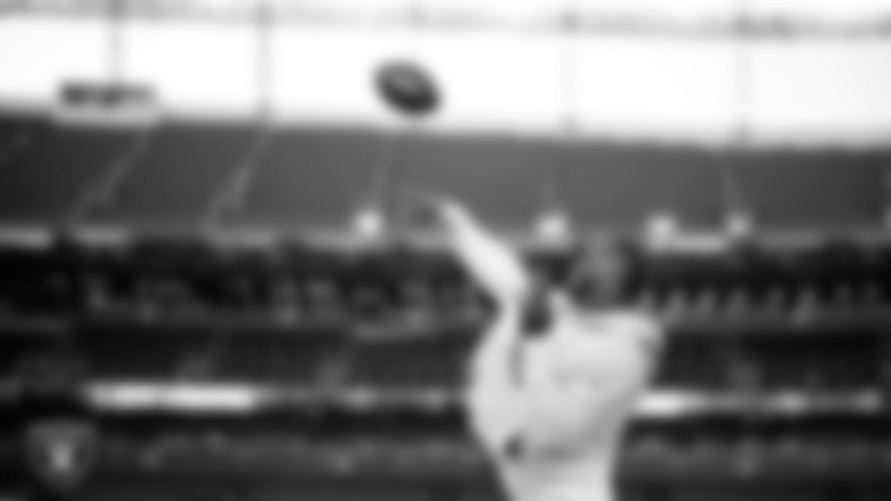 Las Vegas Raiders quarterback Geno Smith (7) warming up before the regular season away game against the Denver Broncos at Empower Field at Mile High.