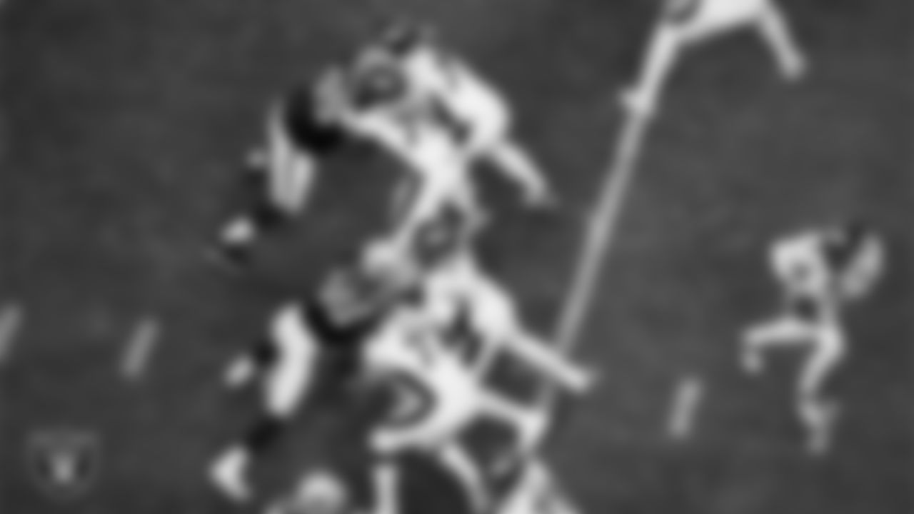 Las Vegas Raiders defensive tackle John Jenkins (95) and defensive lineman Jerry Tillery Jr. (90) defend during the regular season home game against the Denver Broncos at Allegiant Stadium.