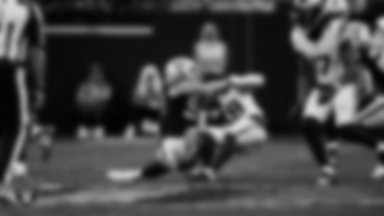 Las Vegas Raiders defensive end Maxx Crosby (98) makes a tackle during the regular season home game against the Denver Broncos at Allegiant Stadium.