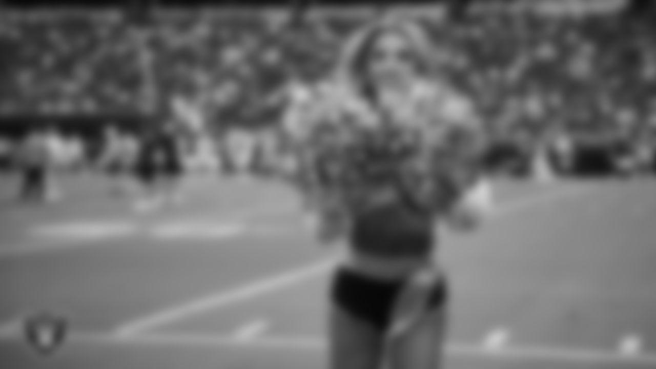 Raiderette Hayley on the sidelines during a 2025 Training Camp mock game at Allegiant Stadium.