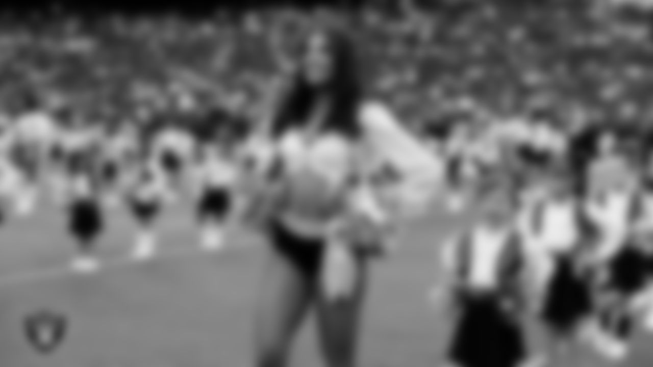 Raiderette Ashtin and Junior Raiderettes perform on the field before the preseason home game against the San Francisco 49ers at Allegiant Stadium.