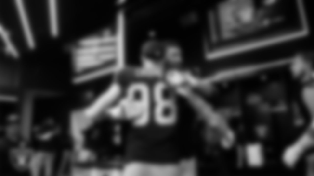 Las Vegas Raiders defensive end Maxx Crosby (98) and offensive lineman Stone Forsythe (70) in the locker room after the regular season home game against the Tennessee Titans at Allegiant Stadium.