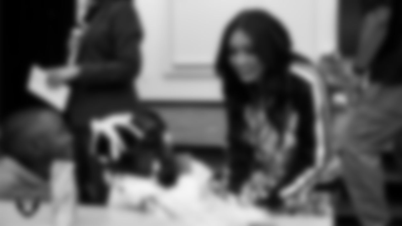 Raiderette Sloane speaks to students during a 'Lil Raiders Pop-Up at Matt Kelly Elementary School.