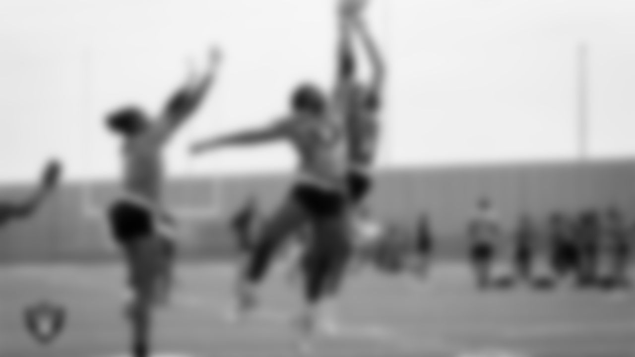 Athletes compete during a girls division Silver and Black League playoff game at Western High School.