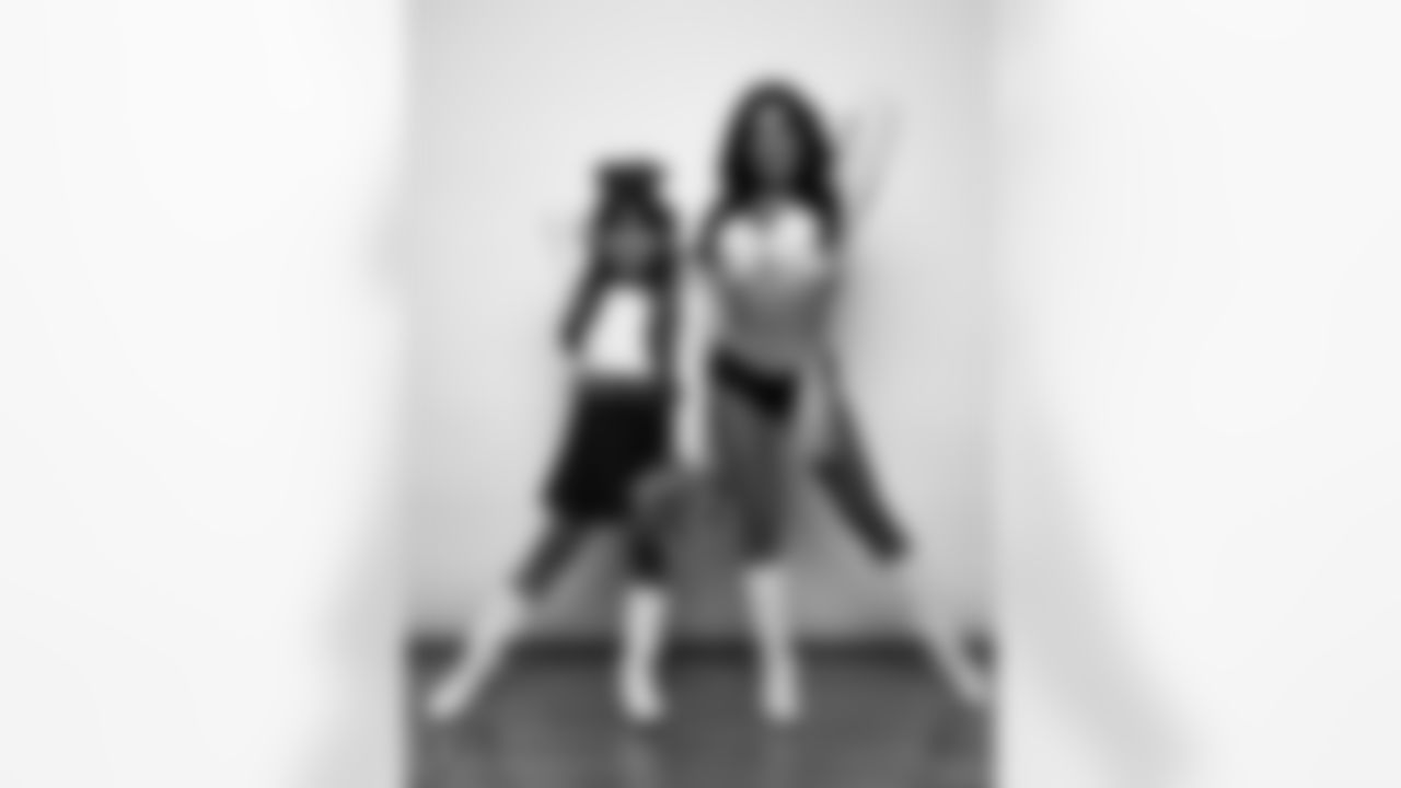 Raiderette Tatiana poses for a photo with a Junior Raiderette during 2025 Media Day at The Studio.