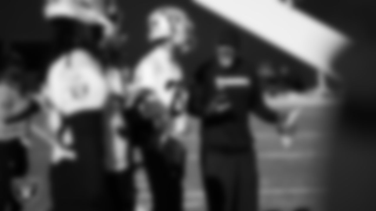 Las Vegas Raiders safety Isaiah Pola-Mao (20) and defensive backs coach Marcus Robertson during practice at Intermountain Health Performance Center.