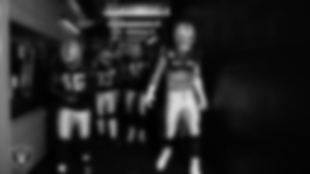 Las Vegas Raiders linebacker Devin White (45) and defensive end Maxx Crosby (98) walk down the tunnel before the regular season home game against the Tennessee Titans at Allegiant Stadium.