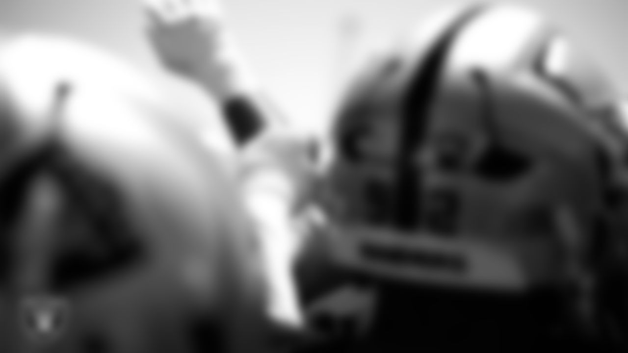 The Las Vegas Raiders huddle at an Organized Team Activity (OTA) at Intermountain Health Performance Center.
