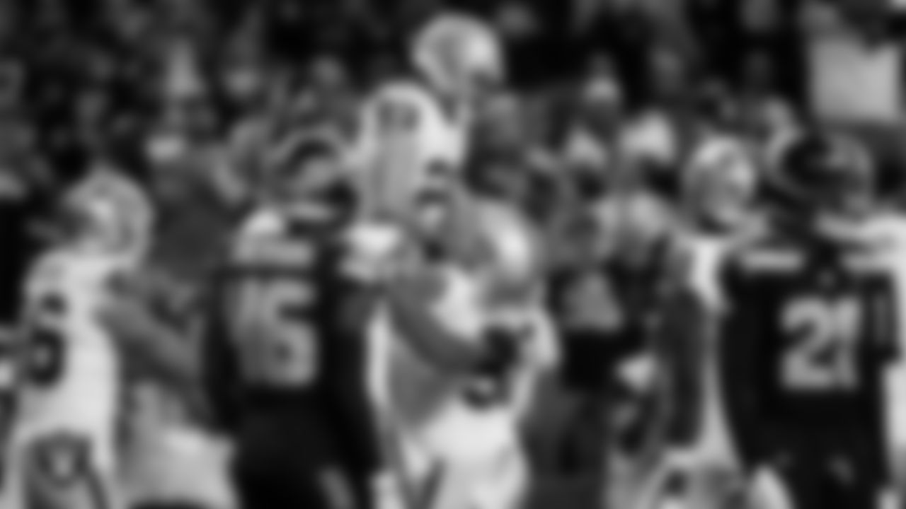 Las Vegas Raiders running back Dylan Laube (23) celebrates with center Jackson Powers-Johnson (58) after making a 6-yard touchdown catch during the preseason away game against the Seattle Seahawks at Lumen Field.