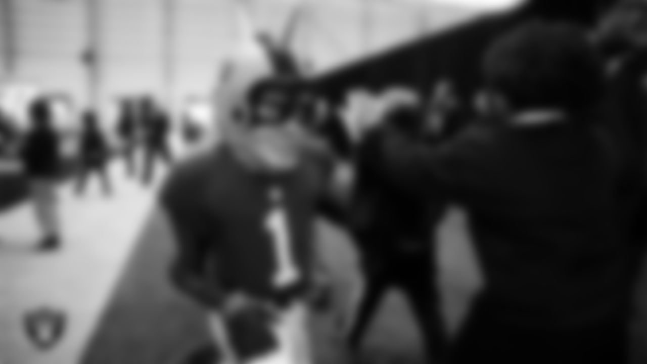 Raider Rusher welcomes students to a Raiders Youth Holiday Party at Intermountain Health Performance Center.