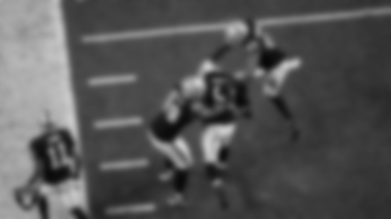 Las Vegas Raiders defensive tackle Tonka Hemingway (97) celebrates with defensive tackle Thomas Booker IV (99) and defensive end Charles Snowden (49) after recovering a fumble during the regular season home game against the Dallas Cowboys at Allegiant Stadium.