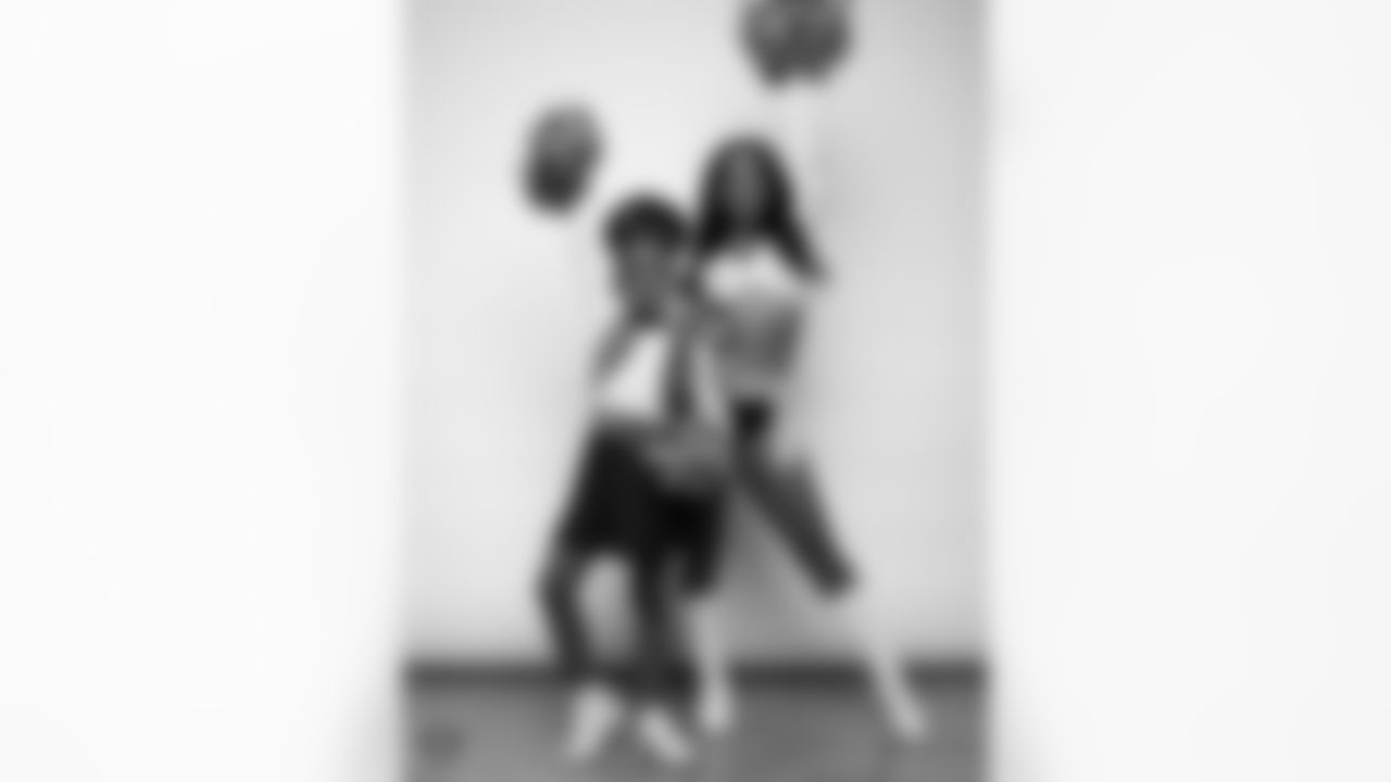 Raiderette Cierra poses for a photo with a Junior Raiderette during 2025 Media Day at The Studio.