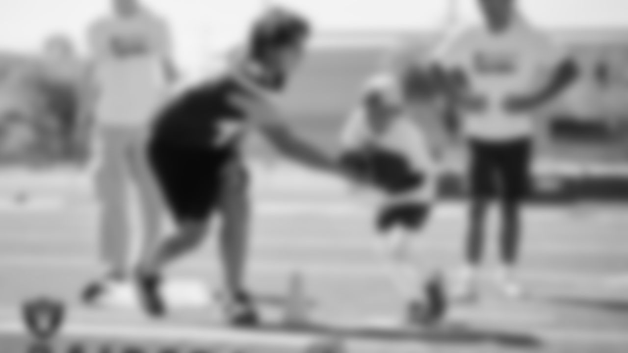 An athlete goes through a drill during a youth football combine at Durango High School.