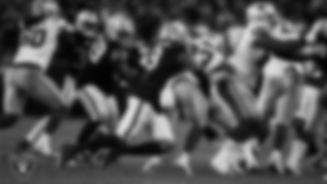 Las Vegas Raiders defensive end Tyree Wilson (9) makes a tackle during the regular season home game against the Dallas Cowboys at Allegiant Stadium.