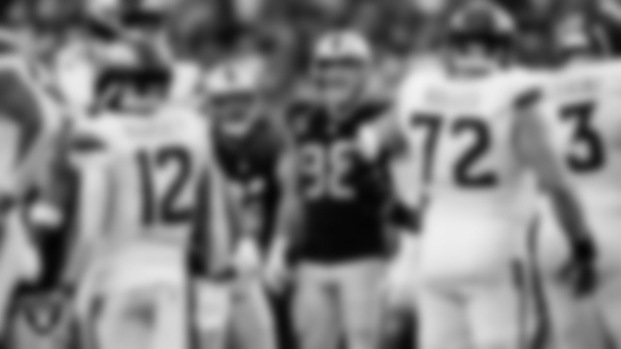 Las Vegas Raiders cornerback Eric Stokes (22) and defensive end Maxx Crosby (98) during the regular season home game against the Denver Broncos at Allegiant Stadium.