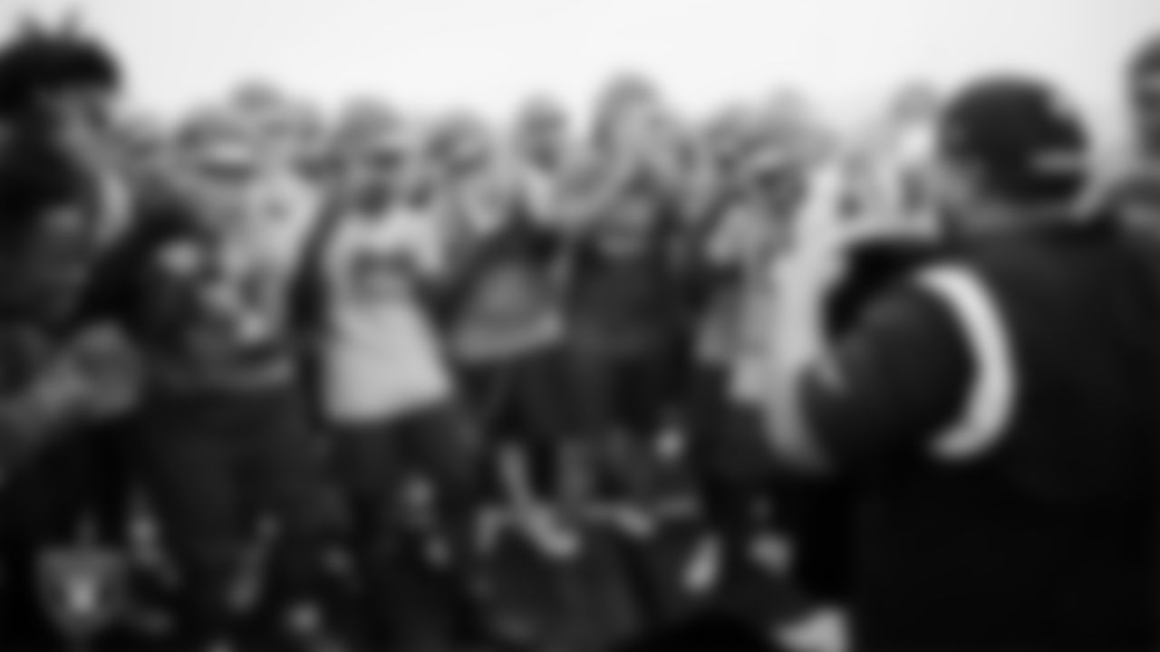 The Arbor View High School football team reacts after being told they are the Las Vegas Raiders game of the week during practice at Arbor View High School.