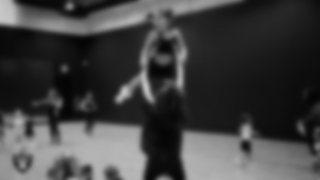 Raiderette Makenna and a dancer during day one of summer camp at The Studio.