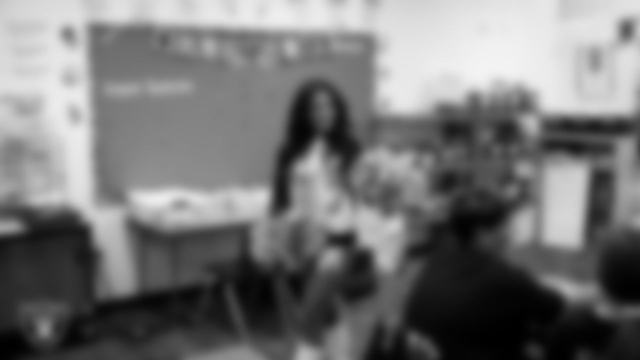 Raiderette Sloane visits a classroom during a 'Lil Raiders Pop-Up at Richard H. Bryan Elementary School.