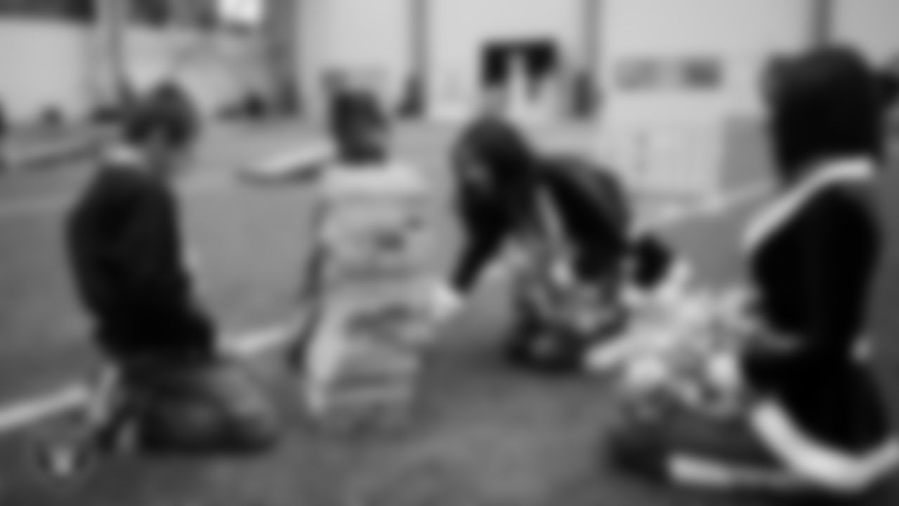 Raiderettes Kylie and Kylee and students enjoy an activity during a Raiders Youth Holiday Party at Intermountain Health Performance Center.