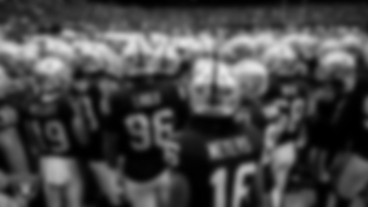 The Las Vegas Raiders huddle before the preseason home game against the San Francisco 49ers at Allegiant Stadium.