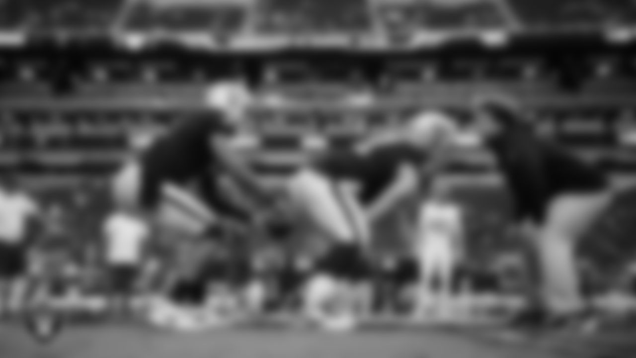 Las Vegas Raiders quarterback Geno Smith (7) and center/guard Jordan Meredith (61) warming up before the regular season home game against the Tennessee Titans at Allegiant Stadium.