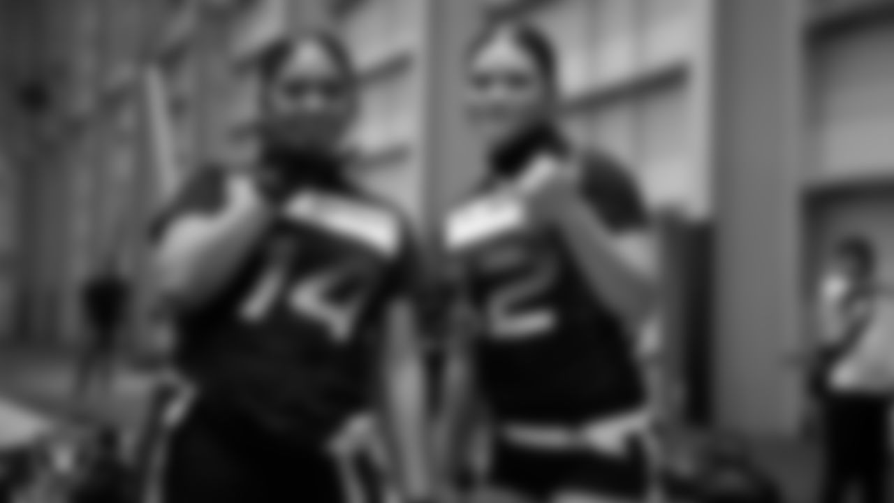 Athletes pose for a photo during practice at Intermountain Health Performance Center.