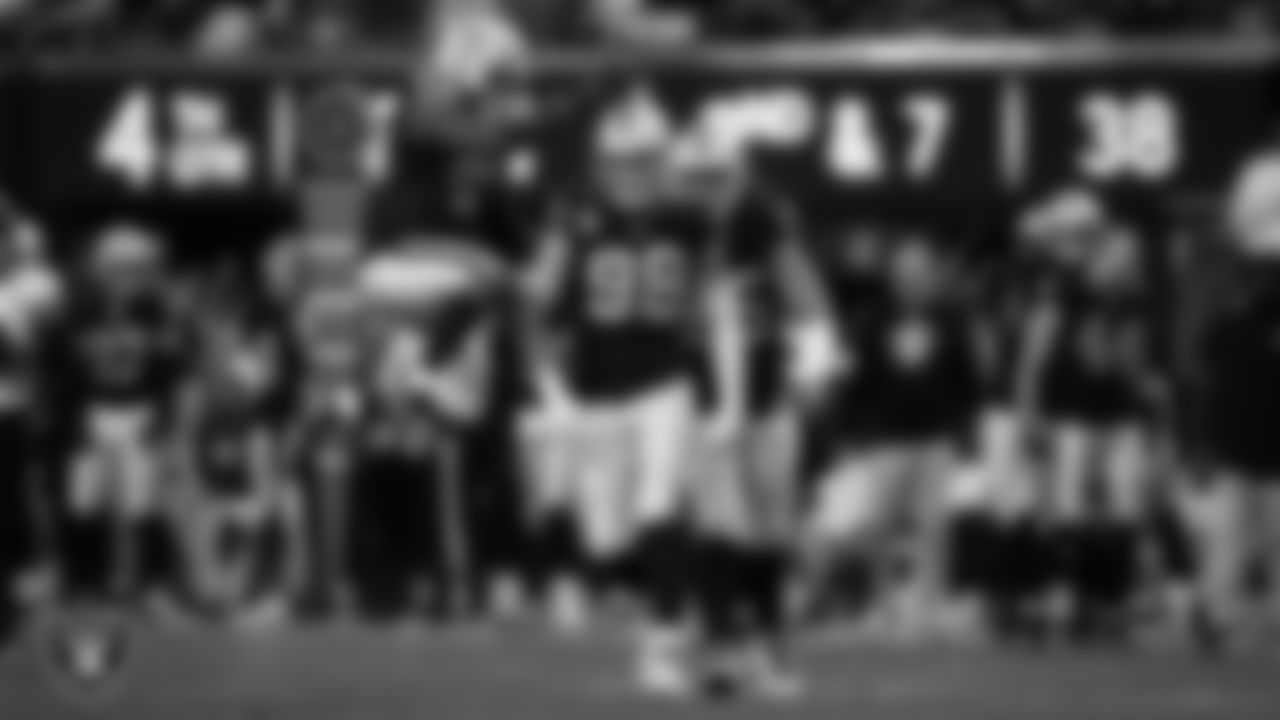 Las Vegas Raiders defensive end Maxx Crosby (98) celebrates with teammates after sacking the quarterback during the regular season home game against the Jacksonville Jaguars at Allegiant Stadium.