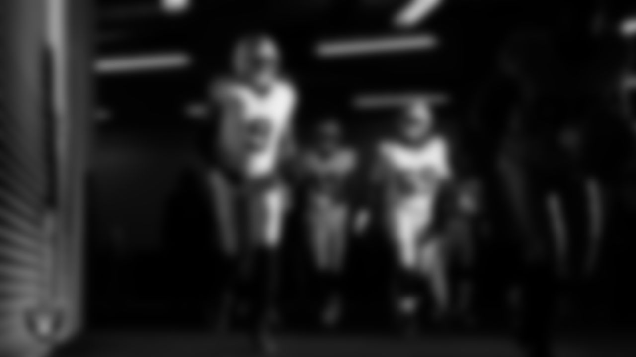 Las Vegas Raiders defensive end Tyree Wilson (9), defensive end Charles Snowden (49) and defensive tackle Adam Butler (69) walk down the tunnel before the regular season away game against the Indianapolis Colts at Lucas Oil Stadium.