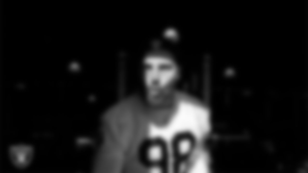 Las Vegas Raiders defensive end Maxx Crosby (98) walks out to the field for practice at Intermountain Health Performance Center.