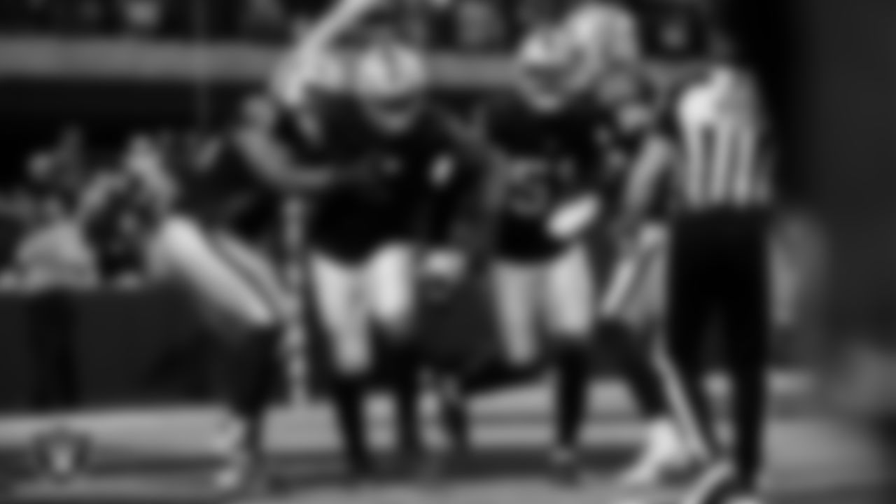 Las Vegas Raiders defensive end Tyree Wilson (9) celebrates with teammates after sacking the quarterback for a safety during the regular season home game against the Kansas City Chiefs at Allegiant Stadium.