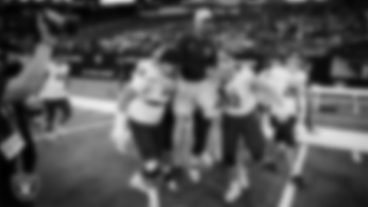 The Spanish Springs High School football team celebrates after defeating Faith Lutheran High School in the NIAA 5A Division State Championship game at Allegiant Stadium.