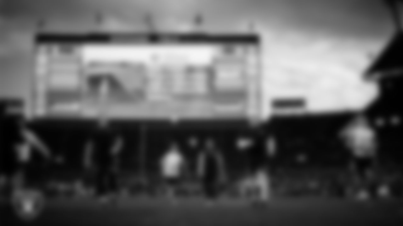 The Las Vegas Raiders warming up before the regular season away game against the Denver Broncos at Empower Field at Mile High.