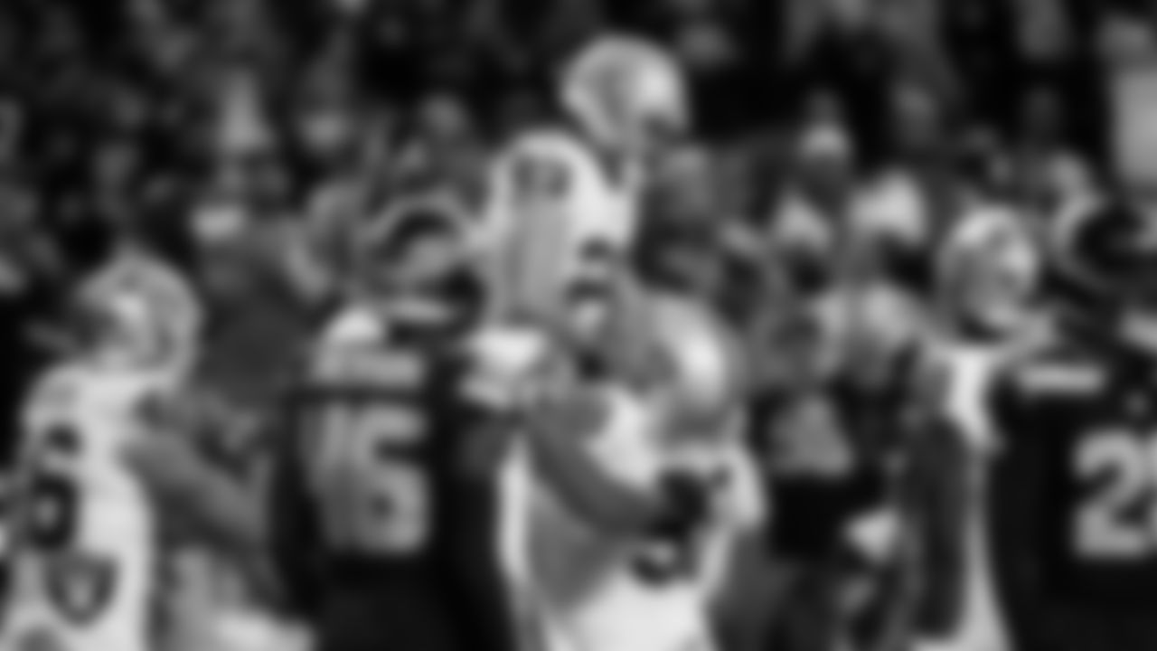 Las Vegas Raiders running back Dylan Laube (23) celebrates with center Jackson Powers-Johnson (58) after making a 6-yard touchdown catch during the preseason away game against the Seattle Seahawks at Lumen Field.