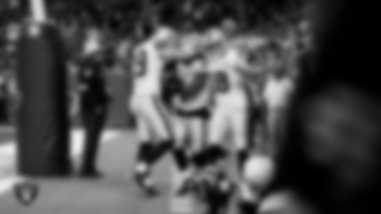 Las Vegas Raiders running back Ashton Jeanty (2) celebrates with teammates after rushing for a 51-yard touchdown during the regular season away game against the Houston Texans at NRG Stadium.