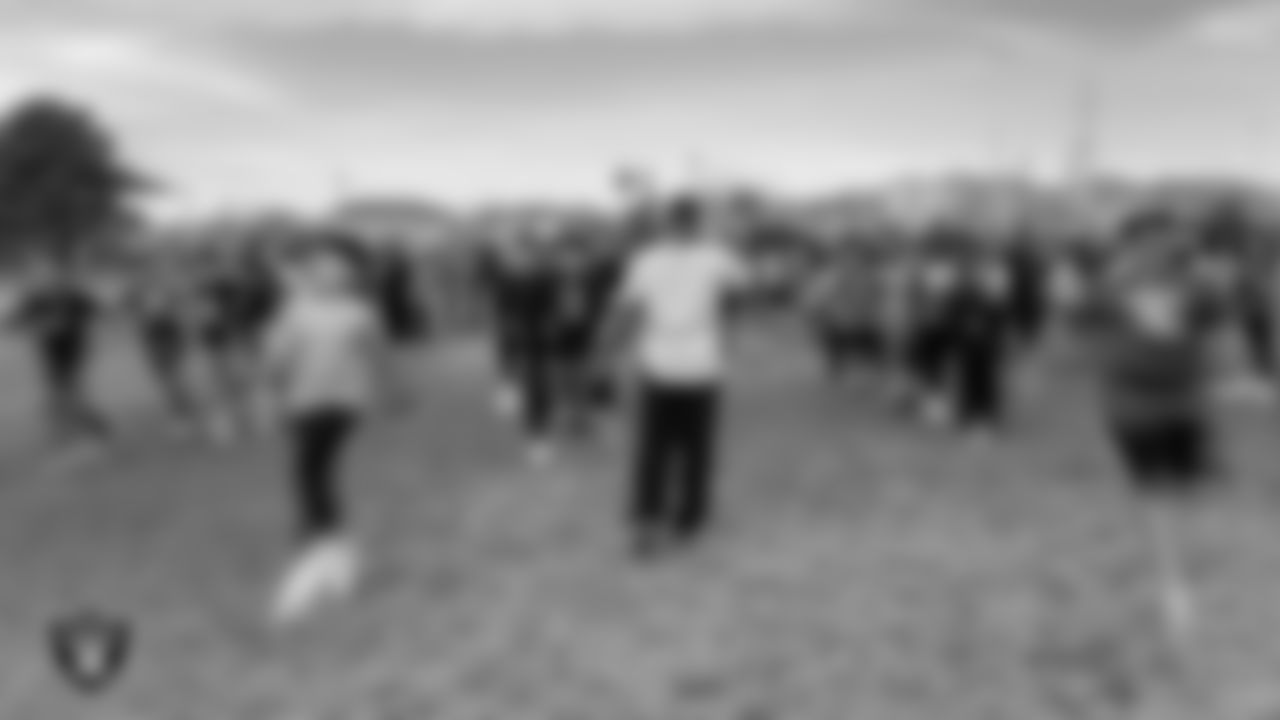 Students warm up during a Raiders Junior Training Camp at O.K. Adcock Elementary School.