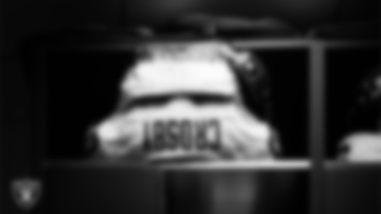 Las Vegas Raiders defensive end Maxx Crosby's (98) pads in the locker room prior to the Raiders' arrival for their regular season away game against the Kansas City Chiefs at GEHA Field at Arrowhead Stadium.