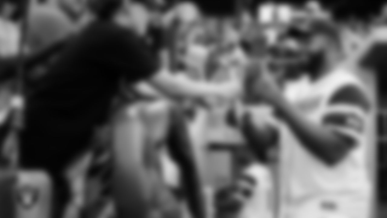 Las Vegas Raiders tackle Thayer Munford Jr. (77) signs autographs before the Battle For Vegas at Las Vegas Ballpark.