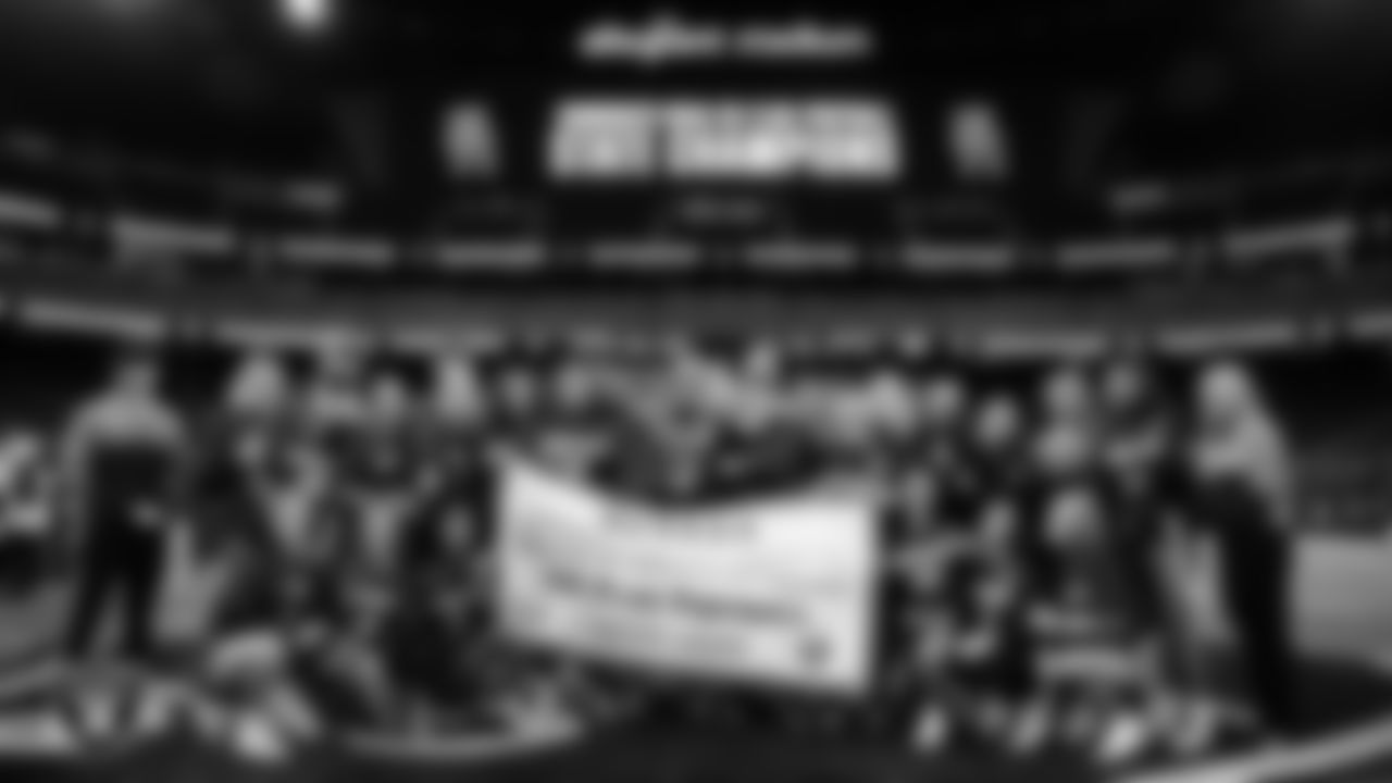 The Shadow Ridge High School flag football team poses for a photo after winning the NIAA 5A Flag Football State Championship game at Allegiant Stadium.