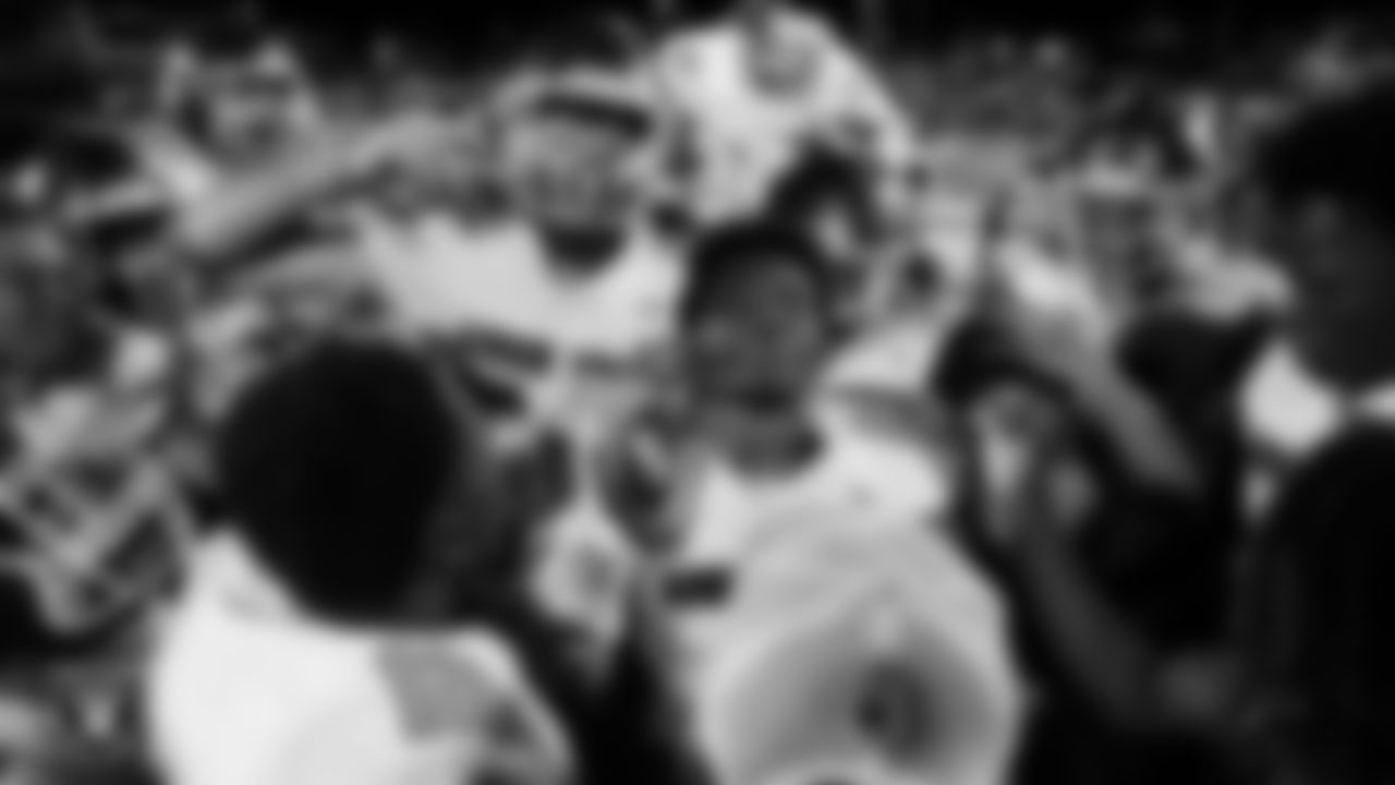 Arbor View High School running back and strong safety Kamareion Bell #0 is congratulated by teammates after being awarded the MVP chain after the Las Vegas Raiders' Football Showcase game at Faith Lutheran High School.