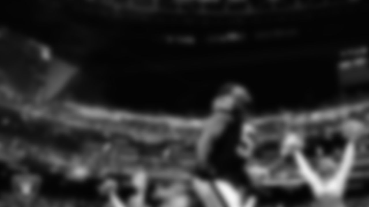 Las Vegas Raiders linebacker Elandon Roberts (52) is introduced onto the field before the regular season home game against the Tennessee Titans at Allegiant Stadium.