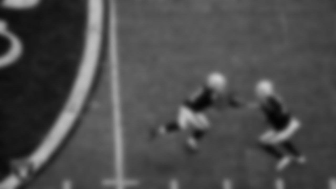 Las Vegas Raiders running back Ashton Jeanty (2) and quarterback Geno Smith (7) during the regular season home game against the Denver Broncos at Allegiant Stadium.