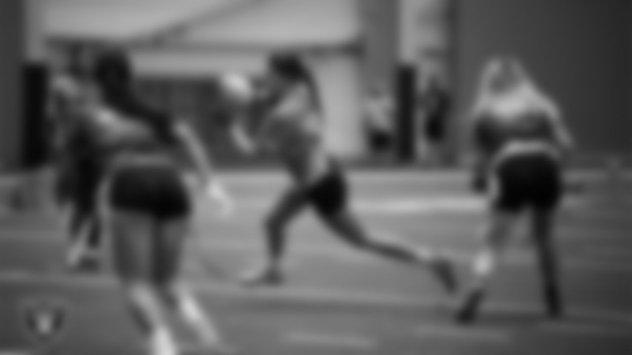Athletes compete in the Silver and Black Championship game during Play Football Day at Intermountain Health Performance Center.