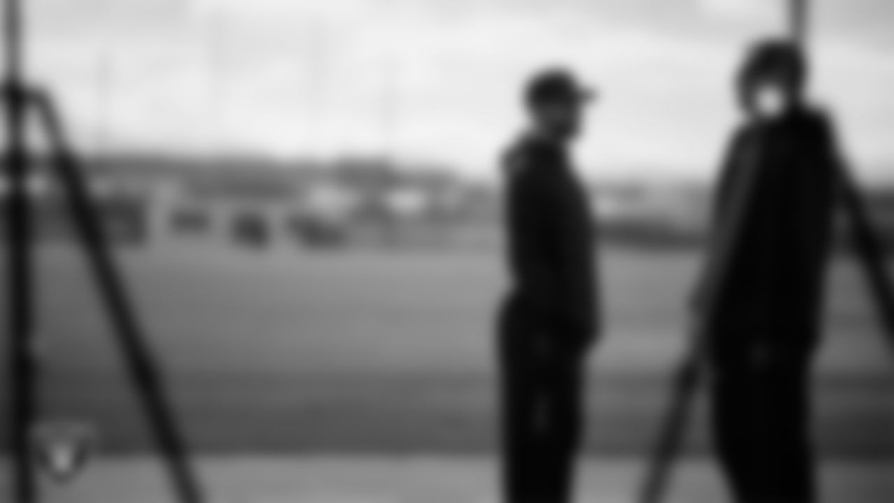 Las Vegas Raiders run game coordinator/defensive line coach Rob Leonard and head strength and conditioning coach A.J. Neibel during practice at Intermountain Health Performance Center.