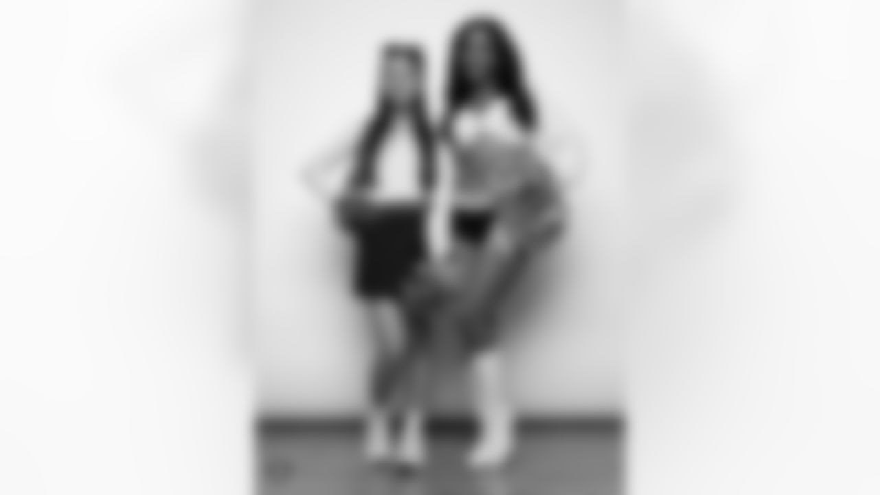 Raiderette Cierra poses for a photo with a Junior Raiderette during 2025 Media Day at The Studio.