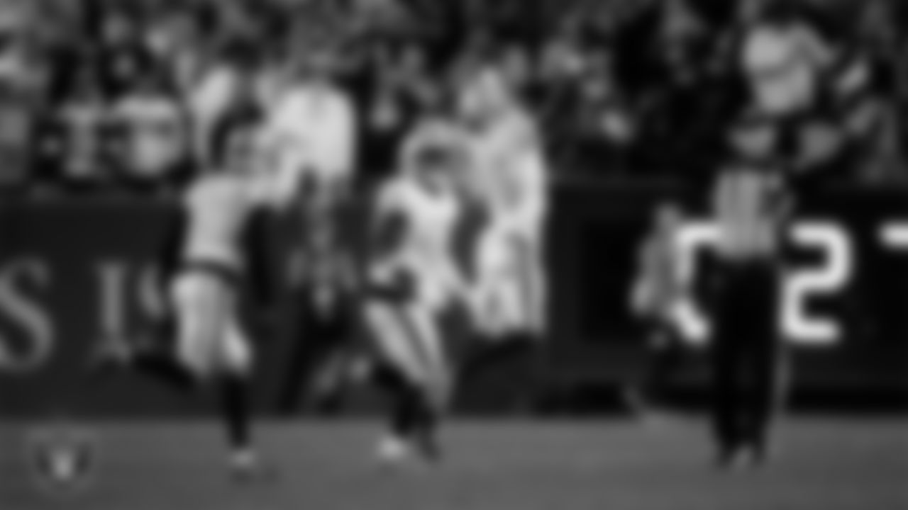 Las Vegas Raiders cornerback Kyu Blu Kelly (36) celebrates with teammates after intercepting a pass during the regular season away game against the Denver Broncos at Empower Field at Mile High.
