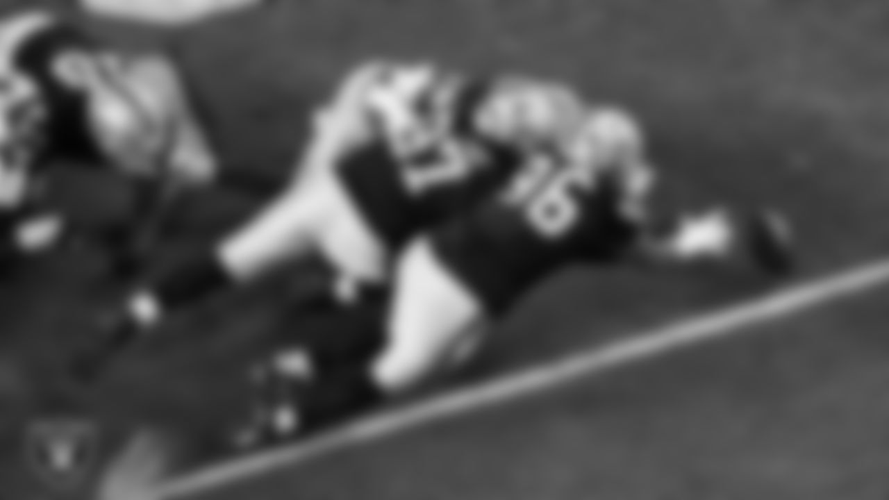 Las Vegas Raiders defensive tackle Tonka Hemingway (97) and defensive tackle Jonah Laulu (96) go to recover a fumble during the regular season home game against the Dallas Cowboys at Allegiant Stadium.