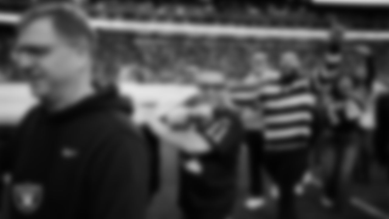 The American flag is displayed by Personal Seat License (PSL) holders on the field during the national anthem before the Las Vegas Raiders' regular season home game against the New York Giants at Allegiant Stadium.